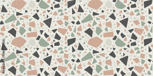 Terrazzo seamless pattern with scattered stone shapes in muted earth tones for interior wall decor and modern flooring surfaces.