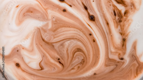 Cuadro en lienzo A close-up abstract image of chocolate milk swirling together creating a beautif
