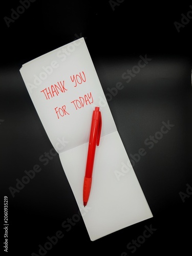 A top-down view of a white notepad with 
