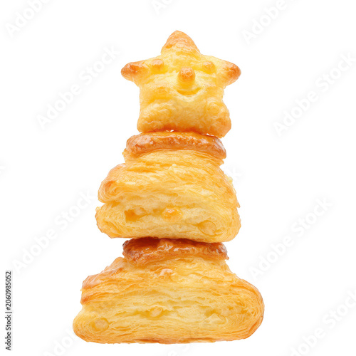Stacked puff pastry pastries in a whimsical stacked shape on black baked sweet isolated on a transparent background