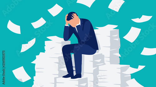 Overwhelmed businessman sitting on paperwork pile in office environment