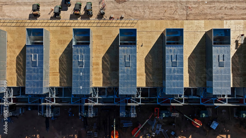 Industrial cooling modules aligned on a plant, drone view