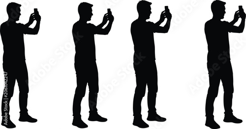 Fotografie Black silhouettes of a man standing and holding up a mobile smartphone to take a