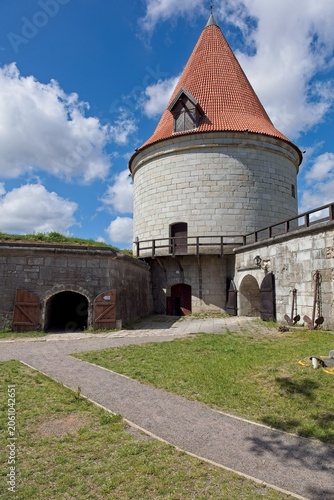 Canvas-taulu Artillery tower (Suurtükitorn) located at Kuressaare Episcopal Castle (Kuressaare Castle) on Saaremaa in summer with clouds in the sky, Estonia, Europe