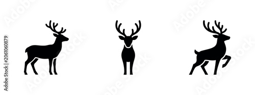 Obraz na plátně Three black silhouette icons of deer with antlers.