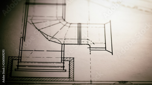 Kitchen stove blueprint plan with ventilation duct layout on paper, clean technical drawing with copy space and soft daylight