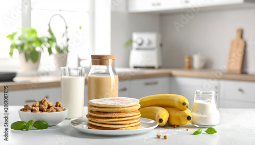 Banana pancake ingredients on kitchen table baking preparation homemade breakfast food scene