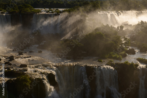 Dramatic iguazu falls cascading water through mist creating awe inspiring nature landscape