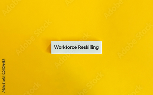 Workforce reskilling business strategy text white block yellow background concept representing human resources employee training corporate education and career development