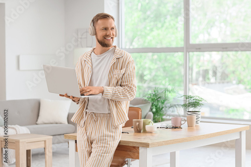 Smiling man in pajamas with...