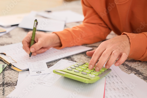Mature woman in debt using ...