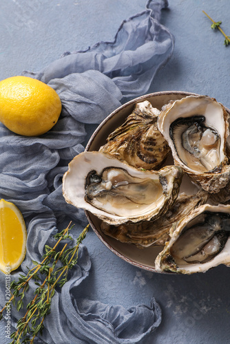 Fresh raw oysters with lemo...