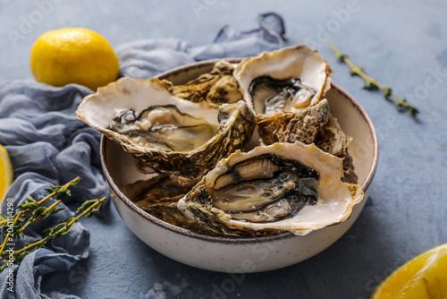 Fresh raw oysters on ice wi...