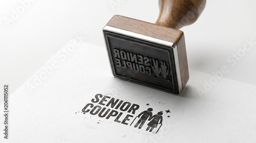 Vintage wooden rubber stamp with Senior Couple text, black ink logo on white paper, elderly care and retirement concept branding