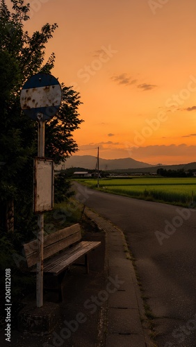 田舎のバス停と夕焼けの風景 / Rural bus stop and countryside sunset landscape (Generative AI)