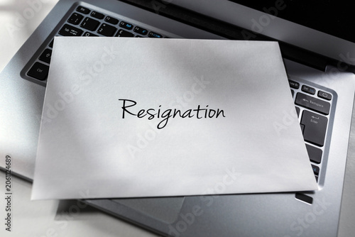 Resignation letter envelope placed on laptop computer keyboard