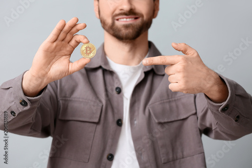 Young man pointing at bitco...