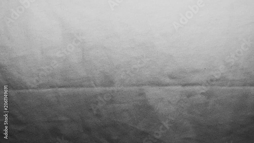 monochrome linen fabric texture gradient ripples slowly under cinematic studio lighting creating elegant shadow movement