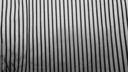 striped fabric ripples gently creating dynamic monochrome optical illusion in cinematic macro pan