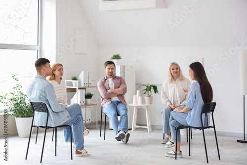 People sitting in chairs at...