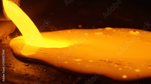 Liquid metal smelting and dumping scene, flowing golden magma