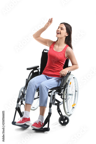 Happy young woman in wheelc...
