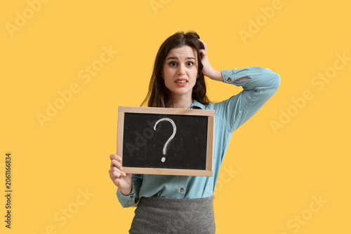 Stressed female teacher hol...