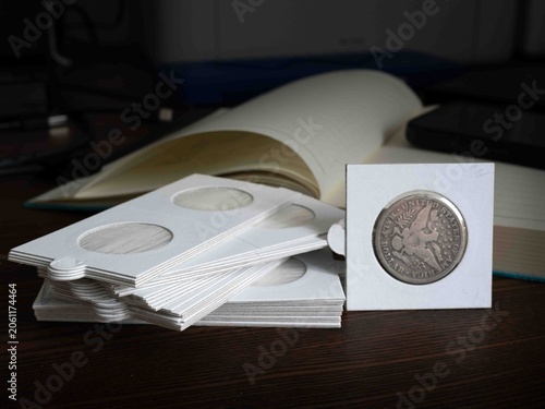 proprietary cardboard sleeve flips for storing and presenting valuable numastic coins silver and gold