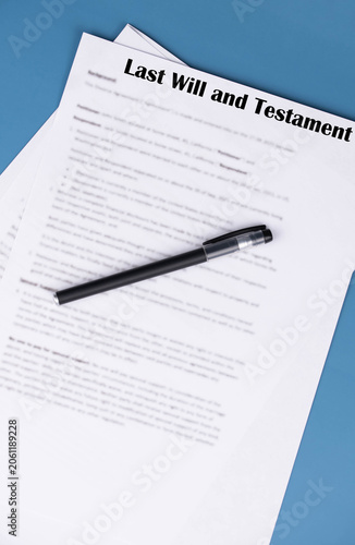 Last Will and Testament document lying on a table, concept of estate planning, inheritance, and legal paperwork.