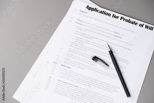 Application for Probate of Will document lying on a table, concept of estate validation, inheritance approval, and court procedure.