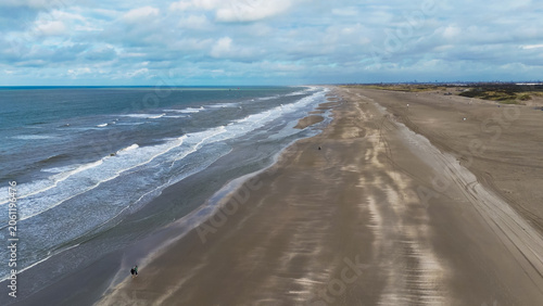 Fotografie Aerial drone view of a sandy beach on the English Channel coast of Normandy, France
