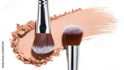 Quadro su tela Two makeup brushes with brown bristles and silver handles on loose powder and fo