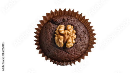 Obraz na plátne Chocolate muffin with walnut topping in paper liner