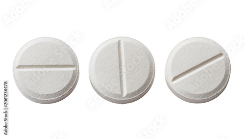 Tableau sur toile Three white round pills with score lines