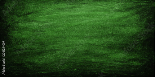 texture of green chalkboard background with chalk marks and natural texture, ideal for creative and educational concepts.