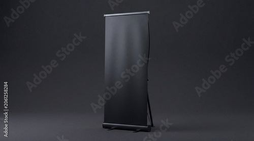 Premium black blank roll-up banner mockup isolated on a dark studio background. Clean, minimalist and modern 3D render, perfect for exhibition, marketing, and trade show advertising displays.