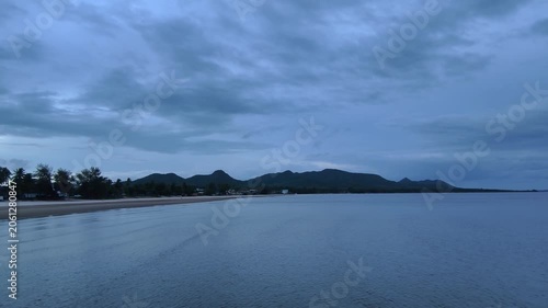 A tranquil beach view under deep blue skies
