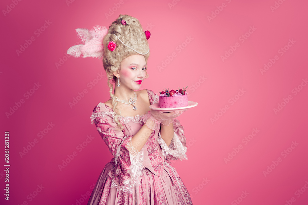 Fototapeta premium Photo of charming positive marie antoinette wear rich dress eating birthday cake empty space isolated pink color background