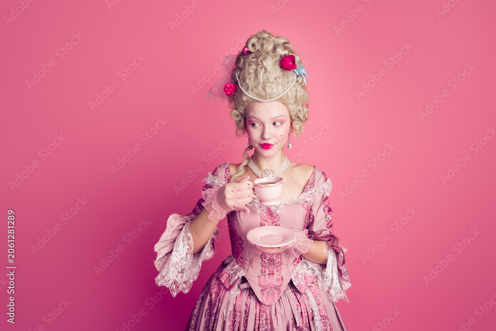Fototapeta premium Photo of happy attractive lady dressed baroque costume enjoying tea copy space isolated pink color background