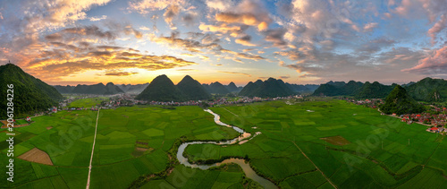 Aerial drone view panorama of Bac Son rice field valley at sunset, Lang Son, Vietnam