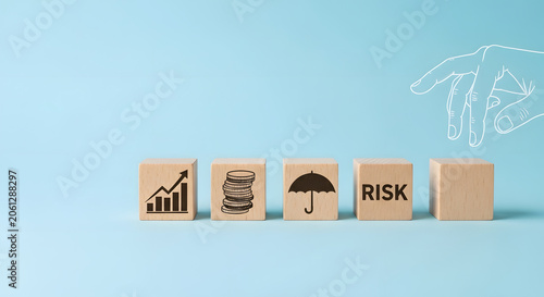 Wooden blocks showing growth, savings, insurance, risk � hand flips final block