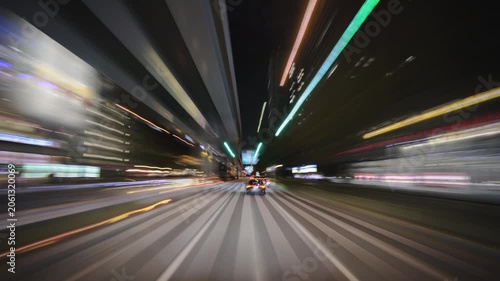 Drivelapse night ride through Tokyo neon metropolis, view from a car windshield, high speed motion-blur highway, beautiful glowing light trails, traffic and skyscrapers time-lapse footage.