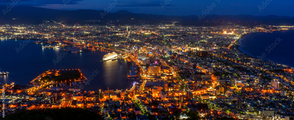 Obraz premium Night view of Hakodate from Mount Hakodate, one of Japan's three famous night views, Hokkaido, Japan. Spectacular night view of Hakodate city seen from Mount Hakodate in Hokkaido, Japan. 