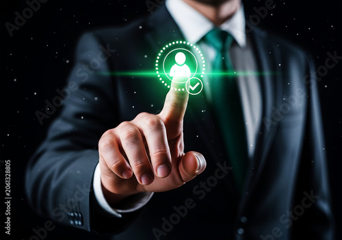 Man in suit touching glowing green user profile icon with checkmark finger screen