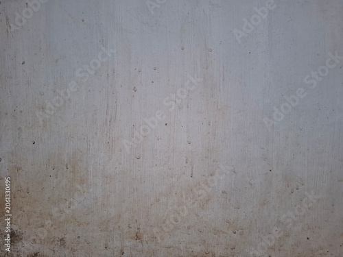Foto Minimalist industrial backdrop showing stained white cement surface with copy space