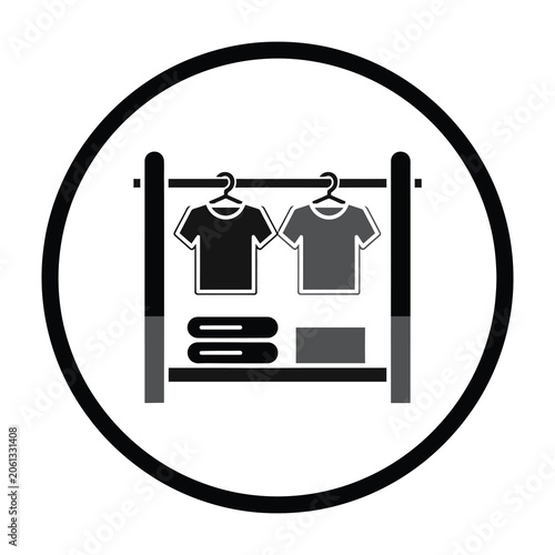 Clothing rack with t shirts and folded laundry