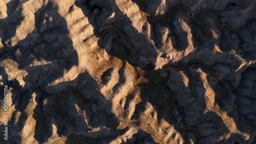 Fotografie Gorafe desert badlands revealing intricate textures and patterns formed by natur