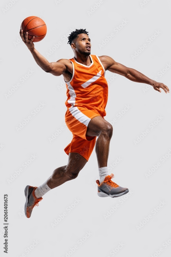Naklejka premium Dynamic basketball player in action.