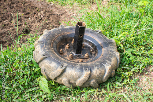 Tractor wheel used as irrigation pump base