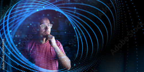 Thoughtful man with glasses surrounded by glowing blue digital particles, data streams and abstract technology interface, representing AI, data analysis, coding and innovation